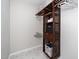 Large walk-in closet with custom wood shelving and hanging rods at 110 Ethans Glenn Ct, Cary, NC 27513