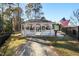 White gazebo with playground view, near a little library and American flag at 110 Ethans Glenn Ct, Cary, NC 27513