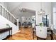 Open concept dining area with hardwood floors and view of living room at 110 Ethans Glenn Ct, Cary, NC 27513