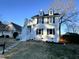 Two-story house with white siding, stone accents, and a manicured lawn at 110 Ethans Glenn Ct, Cary, NC 27513