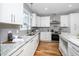 Modern kitchen with white cabinets, granite countertops, and stainless steel appliances at 110 Ethans Glenn Ct, Cary, NC 27513