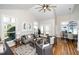 Bright and airy living room with hardwood floors, vaulted ceilings, and comfortable seating at 110 Ethans Glenn Ct, Cary, NC 27513