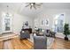 Spacious living room with hardwood floors, vaulted ceilings, and lots of natural light at 110 Ethans Glenn Ct, Cary, NC 27513