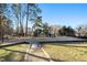 Community playground with modern equipment and a wood-chip surface at 110 Ethans Glenn Ct, Cary, NC 27513