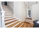 Elegant staircase with white risers and hardwood treads leading to the second floor at 110 Ethans Glenn Ct, Cary, NC 27513