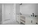 Bright bathroom featuring dual sinks with white cabinetry and marble countertops at 112 1St St, Oxford, NC 27565