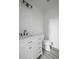 Bright bathroom featuring a modern vanity, sleek fixtures, and vinyl floors at 112 1St St, Oxford, NC 27565