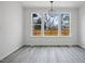 Dining area with large windows and decorative chandelier at 112 1St St, Oxford, NC 27565