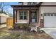 Inviting front porch with stone accents, stylish columns, and a well-maintained entrance, adding curb appeal at 112 1St St, Oxford, NC 27565
