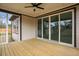 Charming screened porch with wood flooring and views of the outdoors through sliding glass doors at 112 1St St, Oxford, NC 27565