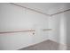 Walk-in closet with wooden clothing racks, providing ample storage and organization at 112 1St St, Oxford, NC 27565