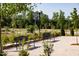 Park benches with greenery and walking paths, ideal for outdoor enjoyment at 116 Kobus Ct, Garner, NC 27529