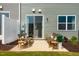 Patio with outdoor seating, sliding glass doors, and green grass at 116 Kobus Ct, Garner, NC 27529