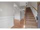 Bright and spacious entryway with hardwood floors and staircase at 116 Saddle Ln, Lillington, NC 27546