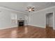 Spacious living room featuring hardwood floors and a stone fireplace at 116 Saddle Ln, Lillington, NC 27546