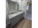 Double vanity bathroom with granite countertop and view of bedroom at 120 Magnolia Run Way, Benson, NC 27504