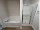 Bathroom features a soaking tub and a separate shower stall at 120 Magnolia Run Way, Benson, NC 27504
