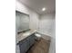Clean bathroom with granite vanity, neutral colors, and a bathtub at 120 Magnolia Run Way, Benson, NC 27504