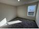 Bright bedroom with carpeted floor and large window at 120 Magnolia Run Way, Benson, NC 27504