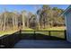 Wooden deck overlooks a spacious backyard and wooded area at 120 Magnolia Run Way, Benson, NC 27504