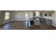 Modern kitchen with gray cabinets, granite countertops, and an island at 120 Magnolia Run Way, Benson, NC 27504
