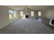 Open concept living room with hardwood and carpeted floors, fireplace and lots of windows at 120 Magnolia Run Way, Benson, NC 27504