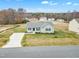 Aerial view of a single-story house with a curved driveway at 120 Starry Sky Dr, Benson, NC 27504