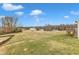 Large backyard with grassy area and partial view of neighborhood at 120 Starry Sky Dr, Benson, NC 27504