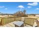 Deck overlooking neighborhood with fire pit and chairs at 120 Starry Sky Dr, Benson, NC 27504
