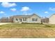 Single-story house with gray siding, a porch, and a driveway at 120 Starry Sky Dr, Benson, NC 27504