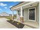 Front porch with rocking chair and stone pillars at 120 Starry Sky Dr, Benson, NC 27504