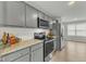 Modern kitchen with grey cabinets and granite countertops at 120 Starry Sky Dr, Benson, NC 27504