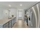Modern kitchen with stainless steel appliances and grey cabinets at 120 Starry Sky Dr, Benson, NC 27504
