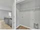 Laundry room with washer and dryer hookups and shelving at 120 Starry Sky Dr, Benson, NC 27504