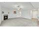Open living room with kitchen view and fireplace at 120 Starry Sky Dr, Benson, NC 27504