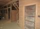 Interior view of the barn with wooden stalls and stairs at 1200 Spring Valley Lake Rd, Henderson, NC 27536