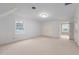 This is a bedroom with neutral carpet, white walls, and white trim at 1200 Spring Valley Lake Rd, Henderson, NC 27536