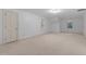 This is a bedroom with neutral carpet, white walls, and two windows at 1200 Spring Valley Lake Rd, Henderson, NC 27536