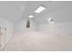 Bright bonus room featuring neutral carpet, dormer window, and recessed lights at 1200 Spring Valley Lake Rd, Henderson, NC 27536