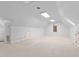 Spacious bonus room with neutral carpet, multiple windows, and ample lighting at 1200 Spring Valley Lake Rd, Henderson, NC 27536