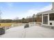 Exterior deck with white railings with view of backyard and trees at 1200 Spring Valley Lake Rd, Henderson, NC 27536