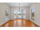 Bright dining area with natural light, hardwood floors, and views of the outdoors at 1200 Spring Valley Lake Rd, Henderson, NC 27536