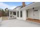 Exterior of white home with a porch and deck at 1200 Spring Valley Lake Rd, Henderson, NC 27536