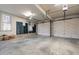 Spacious two car garage featuring automatic door openers and built-in shelving for convenient storage options at 1200 Spring Valley Lake Rd, Henderson, NC 27536