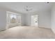 Spacious main bedroom featuring a bay window and light-colored carpet at 1200 Spring Valley Lake Rd, Henderson, NC 27536