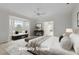 Bright main bedroom featuring a large bay window, sitting area, and neutral tones at 1200 Spring Valley Lake Rd, Henderson, NC 27536