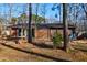 Well-maintained home featuring a partially covered deck and a private backyard at 1225 Kilmory Dr, Cary, NC 27511