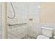 Bathroom with shower, grab bar, and pebble floor at 1225 Kilmory Dr, Cary, NC 27511