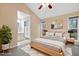 Bright bedroom with a queen-size bed, large windows, and stylish decor at 1225 Kilmory Dr, Cary, NC 27511