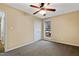 Simple bedroom with ceiling fan and window at 1225 Kilmory Dr, Cary, NC 27511